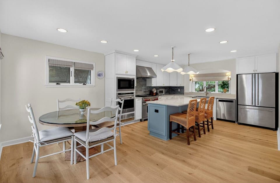 Step into your bright, modern kitchen where coastal charm meets functionality. Prepare meals on spacious counters while guests gather around the island.