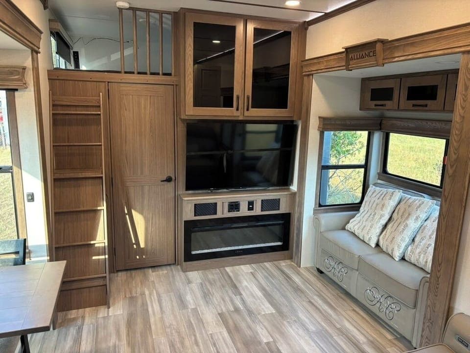 Living room - lots of windows for natural light, Roku TV, with working fireplace