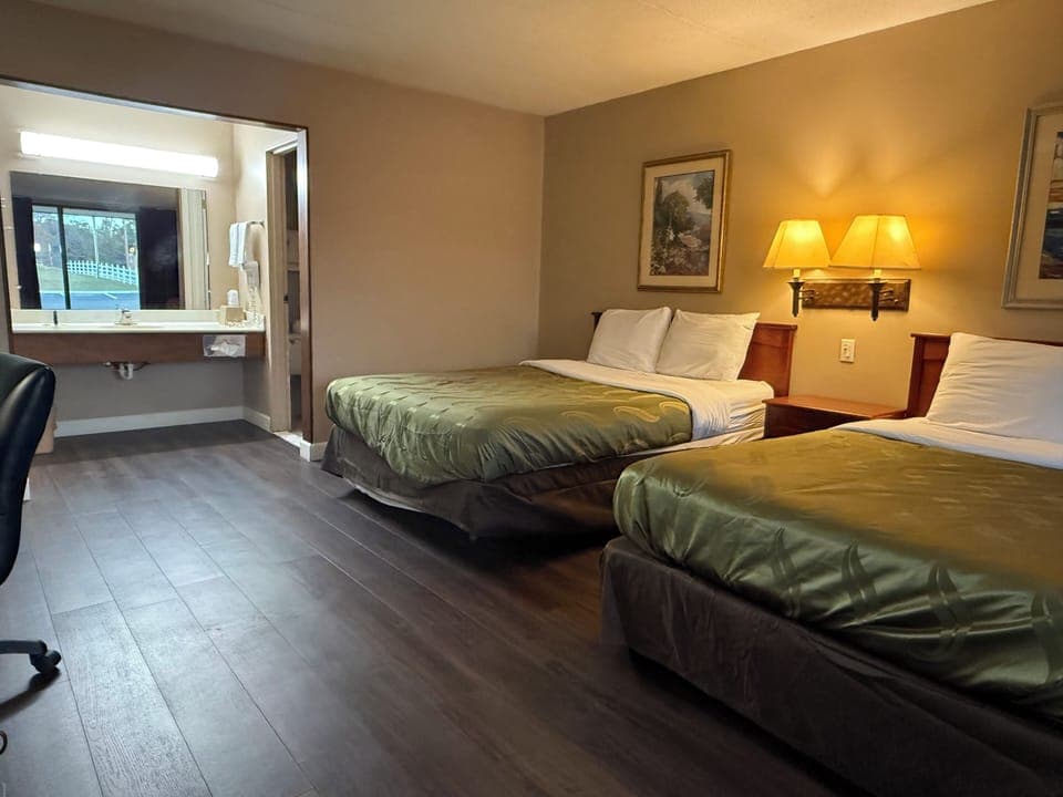 Premium bedding, desk, laptop workspace, iron/ironing board