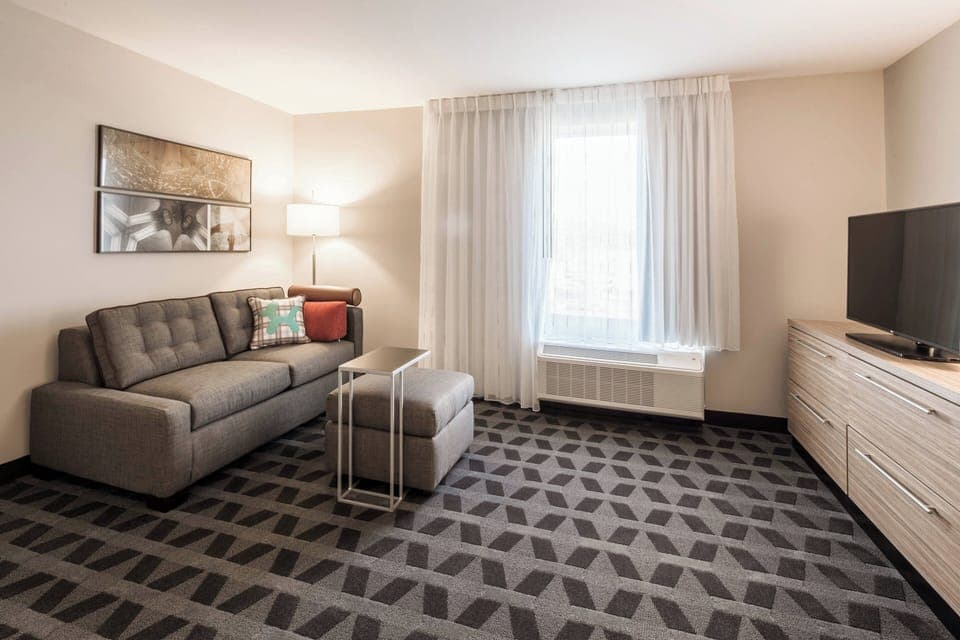 Suite, 1 Bedroom | Living room | TV