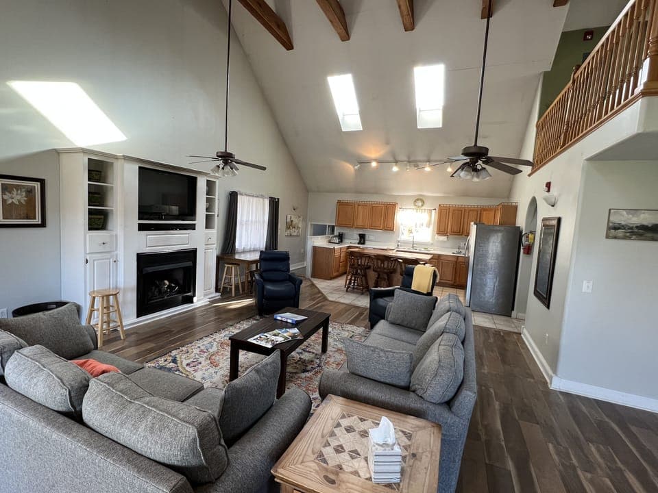 Living room--the couch facing the fireplace is a queen sleeper sofa.  The fireplace is gas burning.