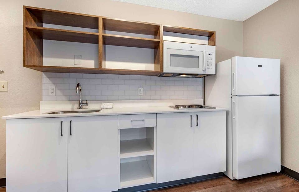 Suite, 1 King Bed, Non Smoking (1 Bedroom) | Private kitchen | Full-size fridge, microwave, stovetop, coffee/tea maker