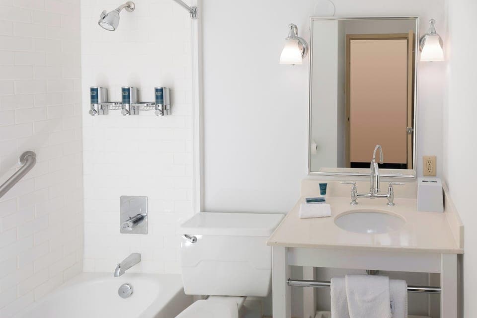 Combined shower/tub, designer toiletries, hair dryer, towels