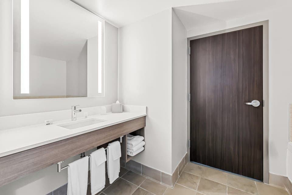 Suite, 1 King Bed (Bath Walk-In Shower) | Bathroom | Combined shower/tub, free toiletries, hair dryer, towels
