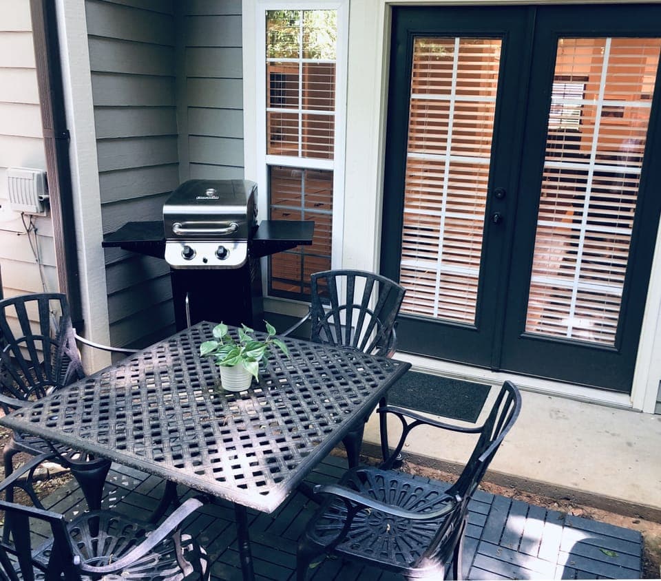 Gas grill and seating for 4 on the back patio