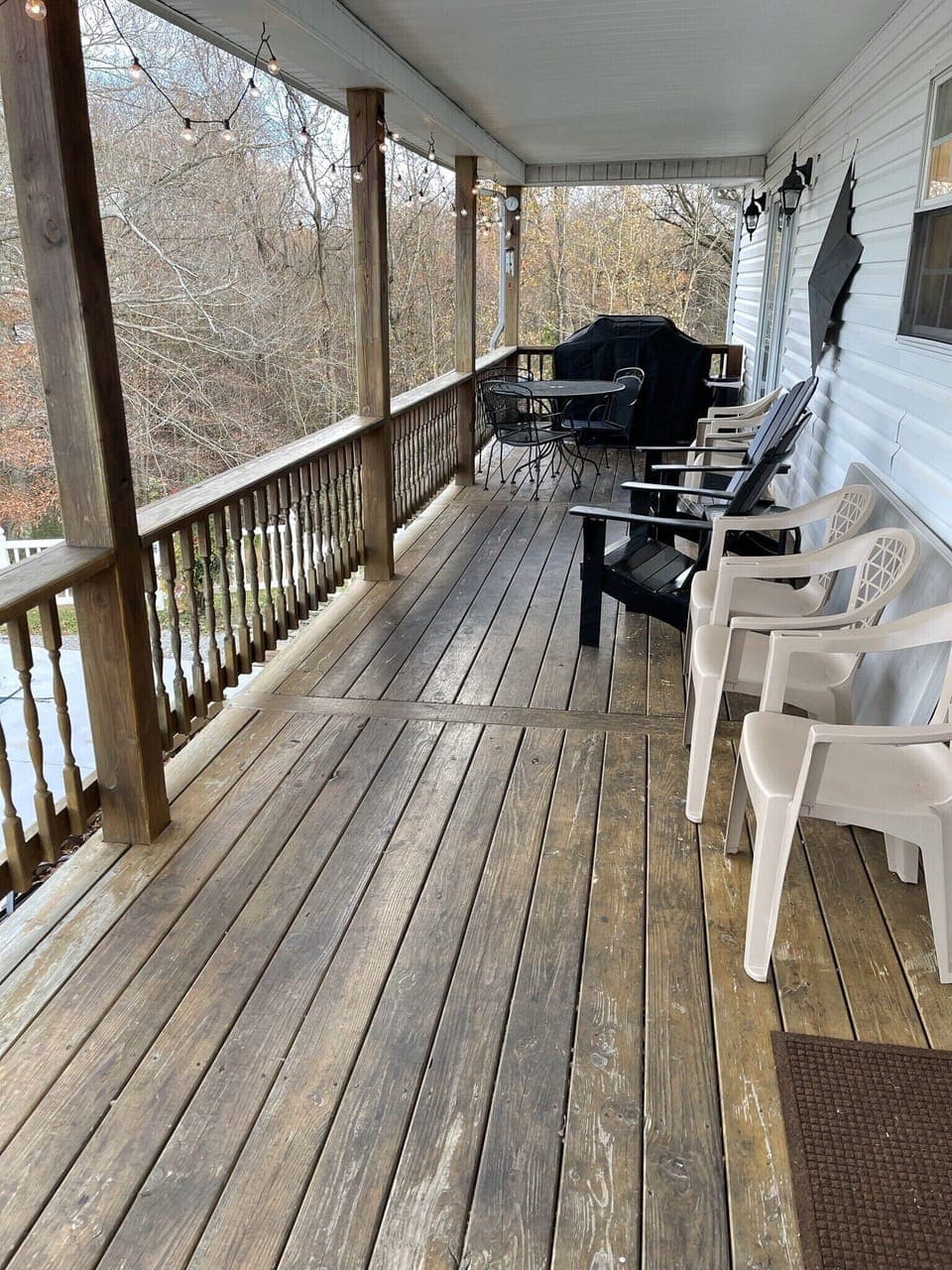 Back porch with grill overlooking pool with scenic view of hills 
