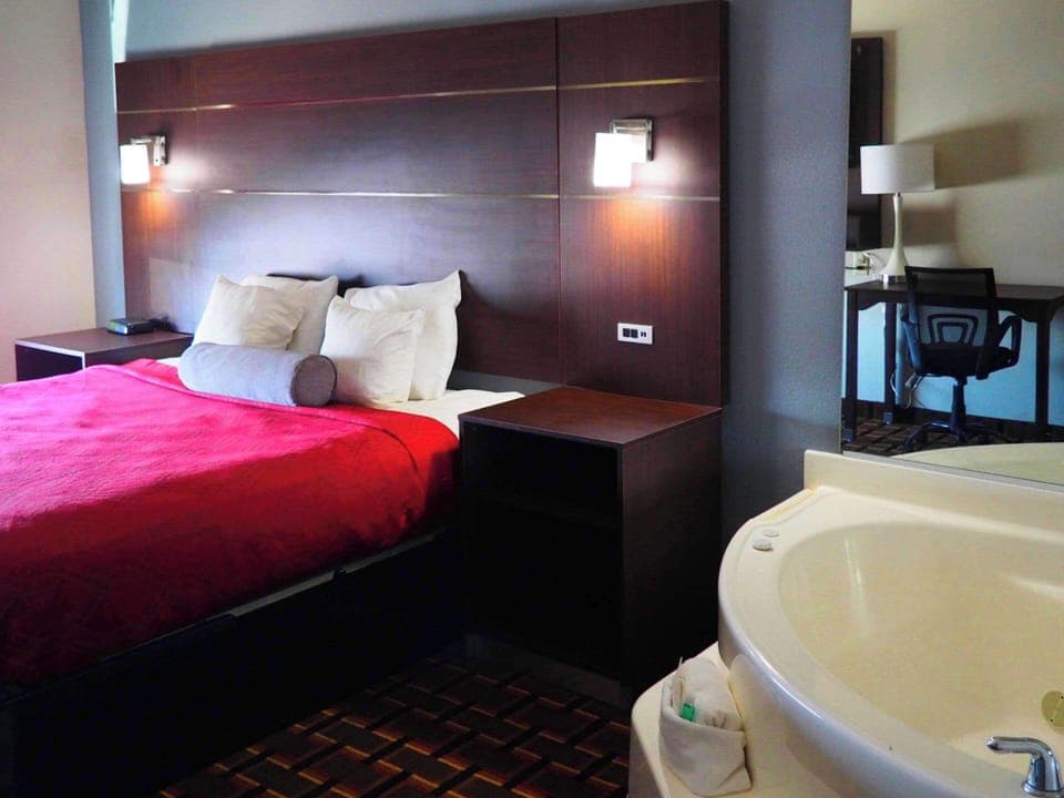 Suite, 1 King Bed, Non Smoking, Hot Tub | Desk, laptop workspace, iron/ironing board, free cribs/infant beds