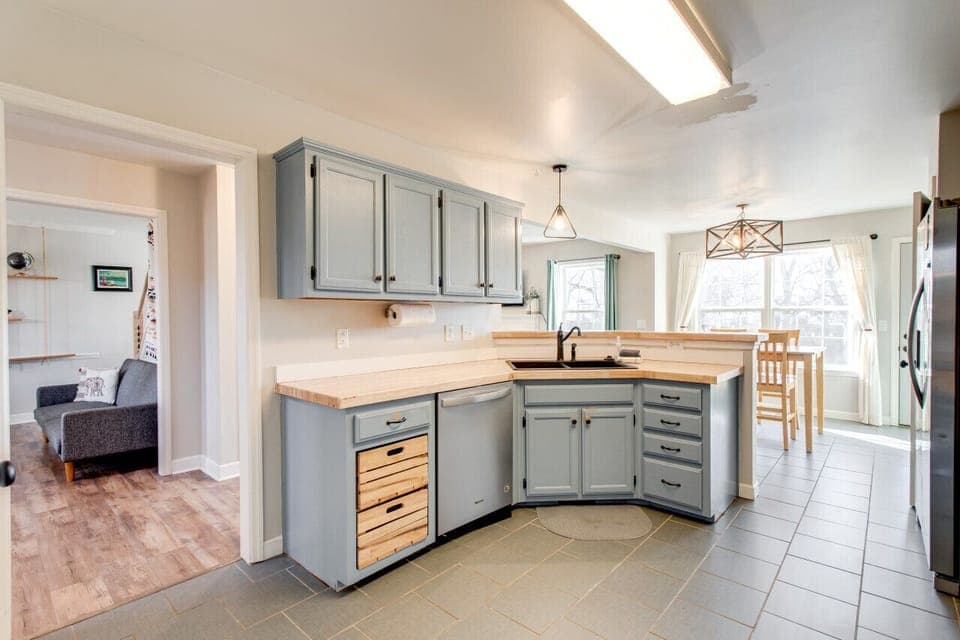 The kitchen opens to both living rooms and the dining room.