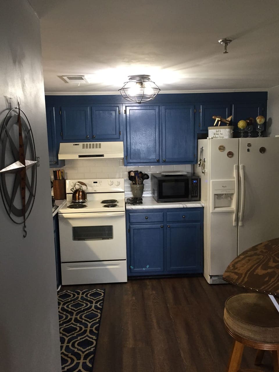 Kitchen filled with great cookware, utensils, lovely dishes and drinkware. 