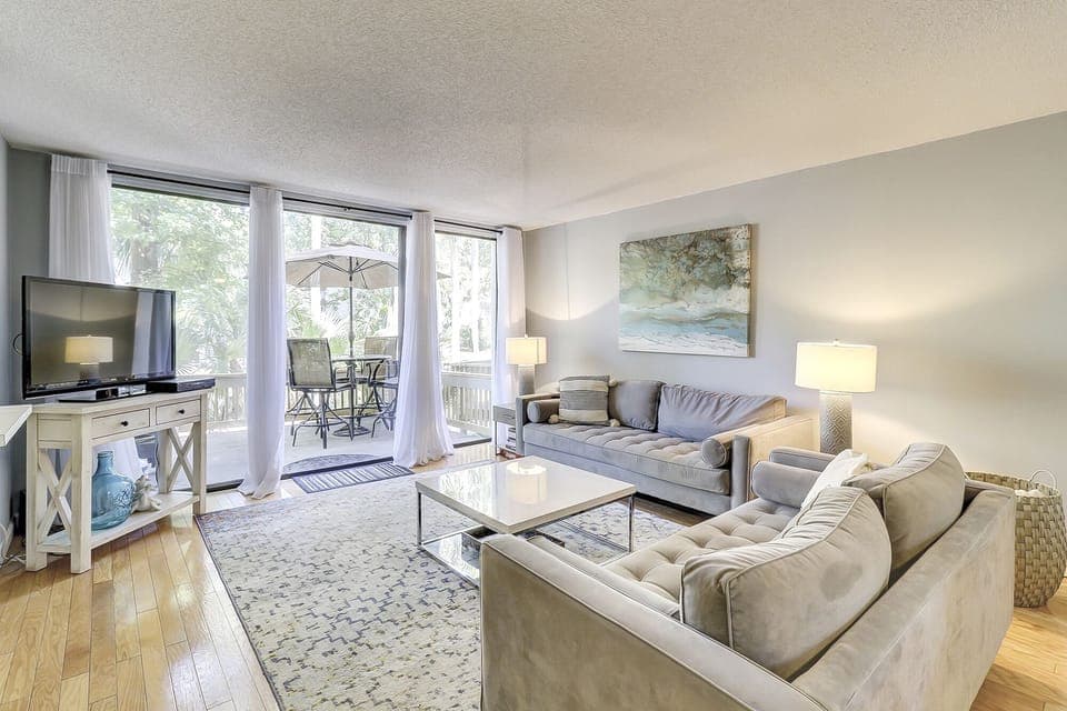 First floor living area with deck overlooking the lagoon. 