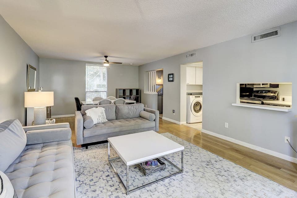 Bright, spacious living area next to kitchen. 