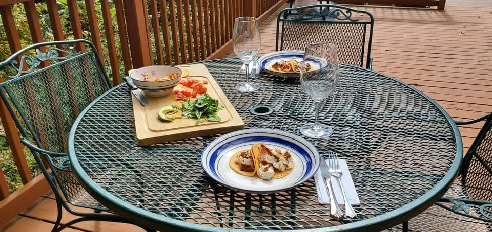 Indulging in lunch on the deck, where every bite comes with a side of nature!