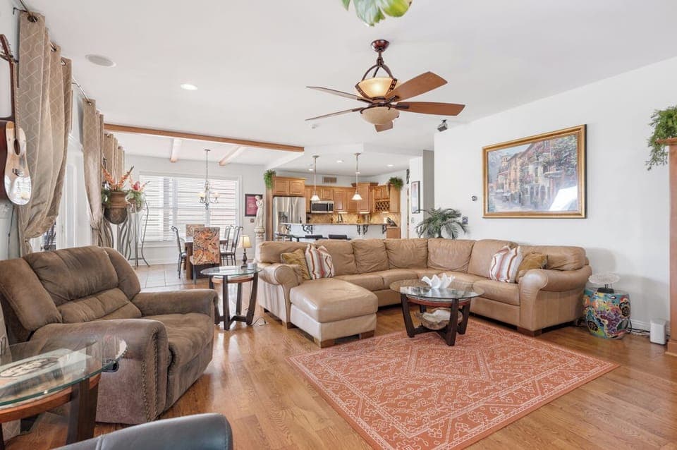 FAMILY ROOM HAS A 61 TV WITH SURROUND SOUND SPEAKERS. 