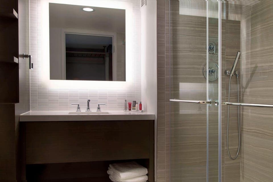Designer toiletries, hair dryer, towels, soap