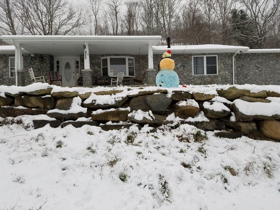 Front of the house with colored snowman
