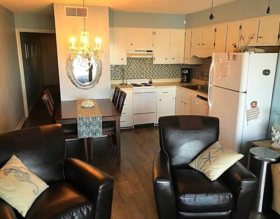 Kitchen with dining table seating four. 