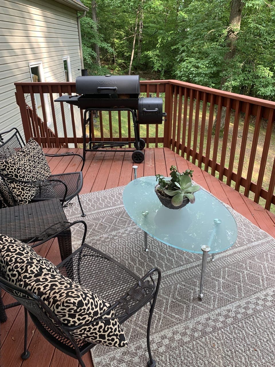 Back deck feels like you are in a  treehouse
Seating areaplus charcoal grill