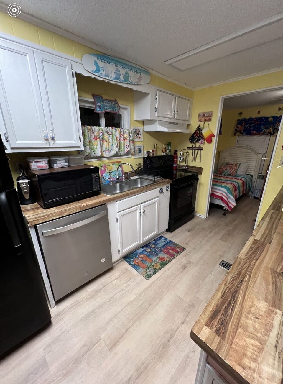 Kitchen with microwave, dishwasher.  Fully stocked