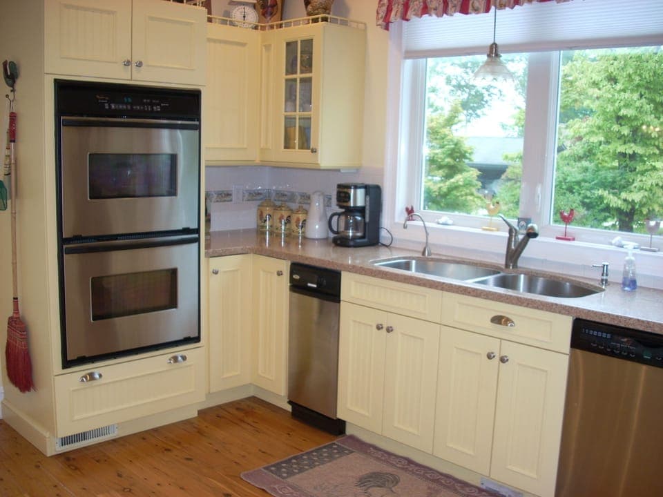 Kitchen corner with double range, coffee maker and dishwasher. Lots of storage. 