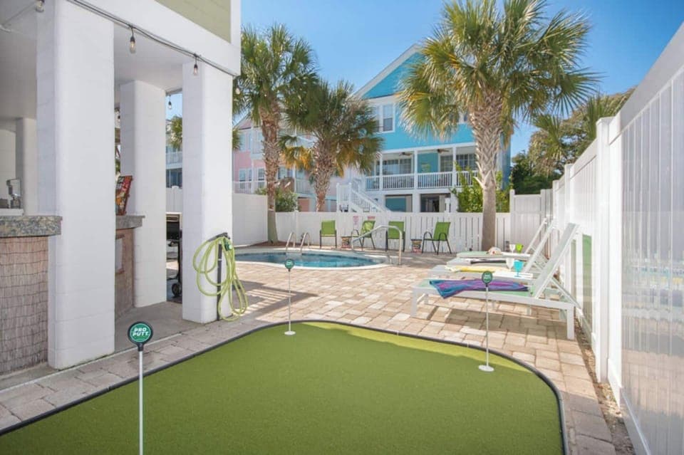 Tee off without leaving the backyard! Your private mini golf setup brings the fun home—perfect for friendly competitions, family laughs, and tropical bragging rights.
