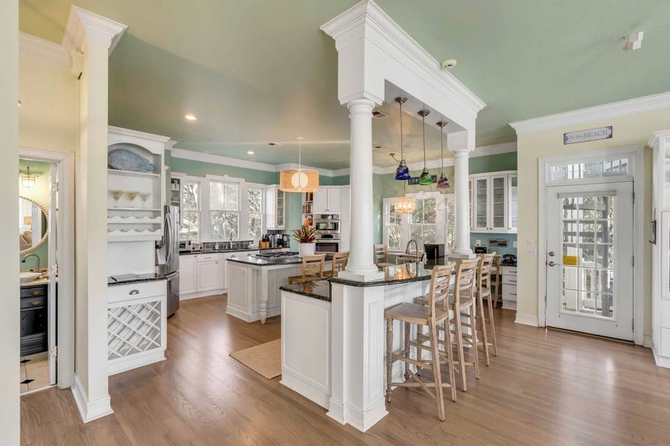 Your large kitchen features elegant columns and a breakfast nook