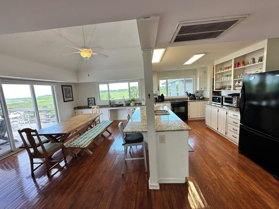 Cooks kitchen with setting on bar and table