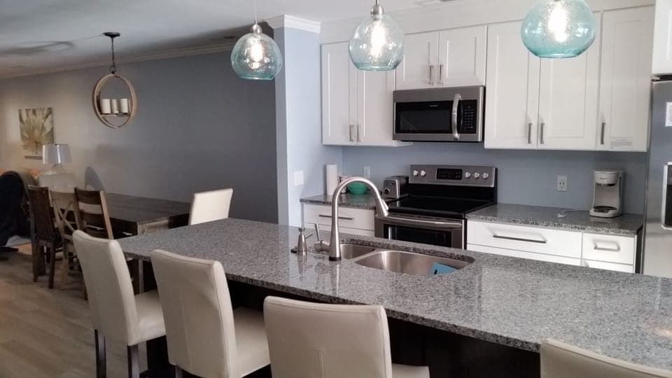 Large eat in island seats 4.  Dinning table seats 8.