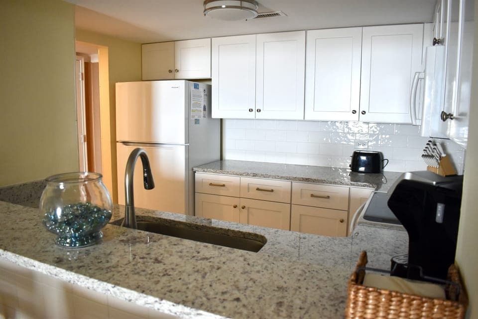Updated Kitchen with White Cabinets & Granite Countertops