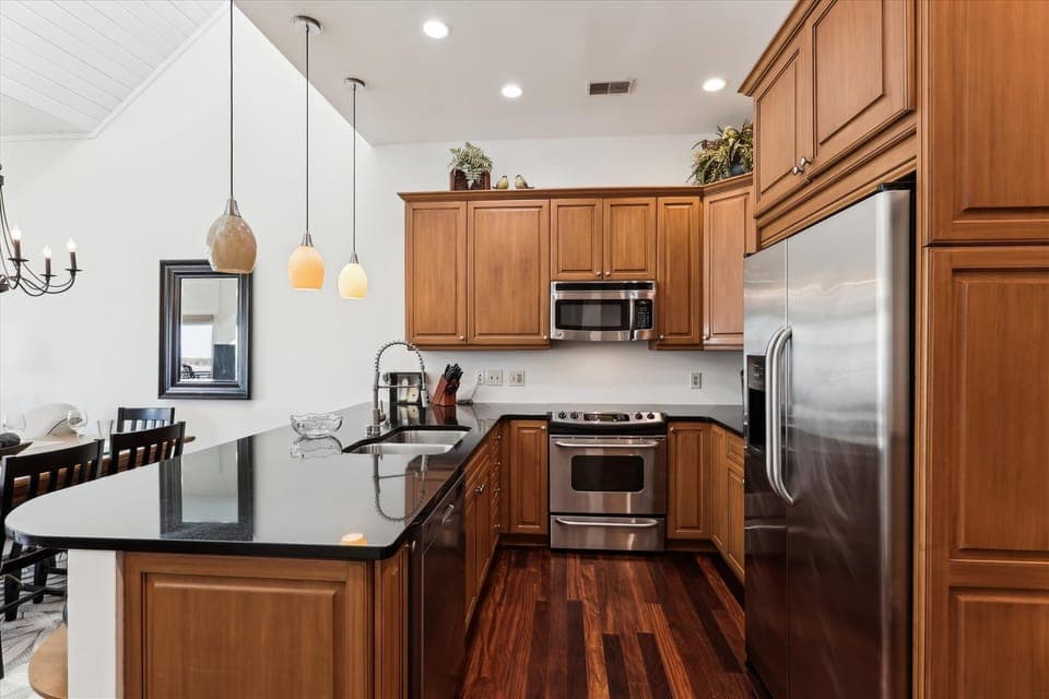 Kitchen with Stainless Steel Appliances at 1900 Beachside Tennis