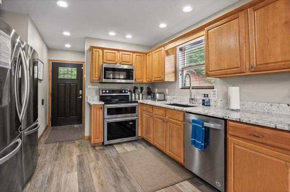 Main floor kitchen and entryway, half bath, Double oven, 2 refrigerators