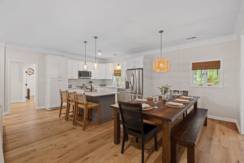 Open concept kitchen, dining and living areas.