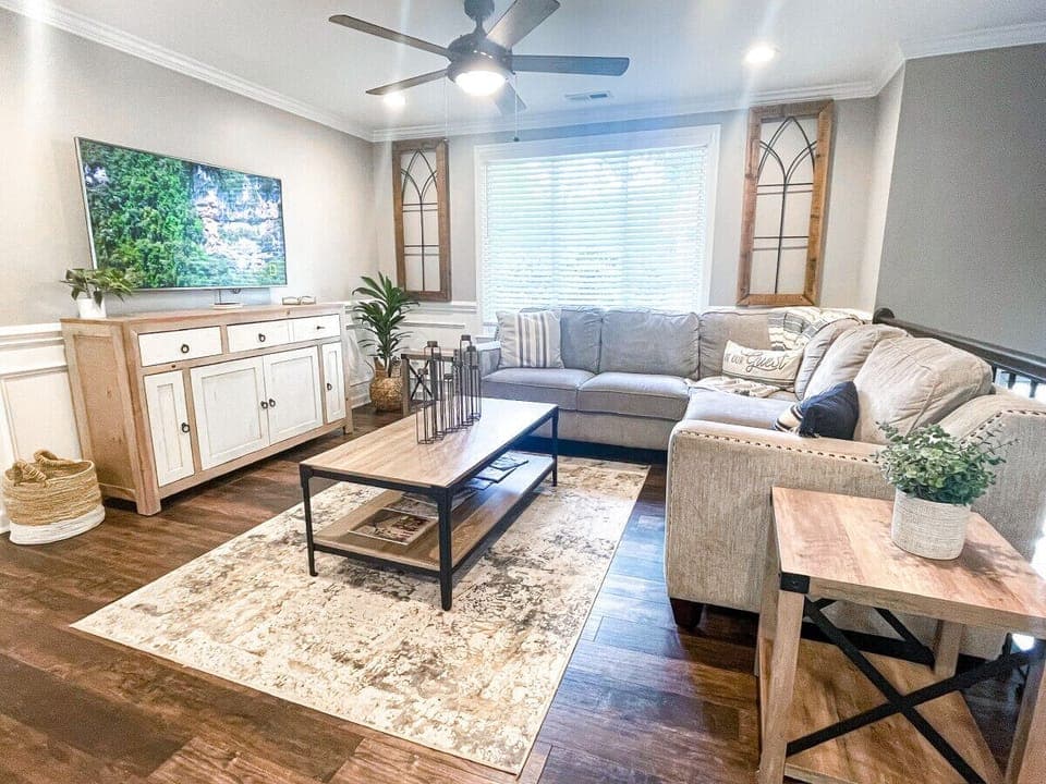 Living Room With Comfy Sectional Makes for the Perfect Place to Watch a Movie.