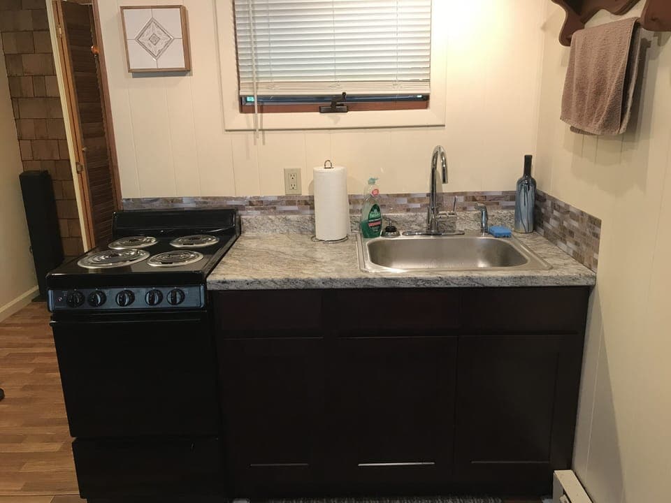 Kitchen area with stove/range 