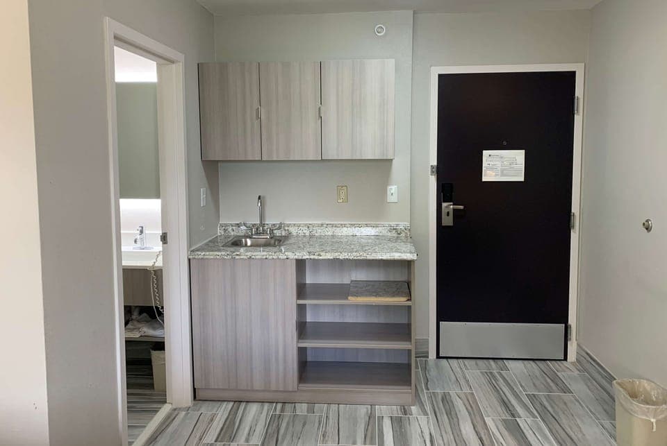 Suite, 1 Queen Bed, Non Smoking | Desk, laptop workspace, blackout drapes, iron/ironing board