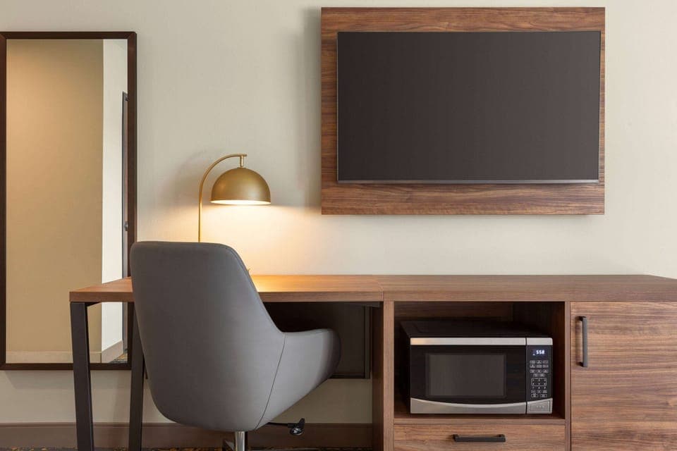 Premium bedding, desk, laptop workspace, soundproofing
