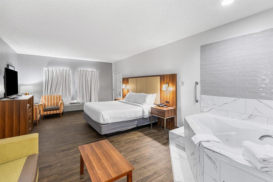 Suite, 1 King Bed, Non Smoking, Jetted Tub | Desk, laptop workspace, iron/ironing board, free WiFi
