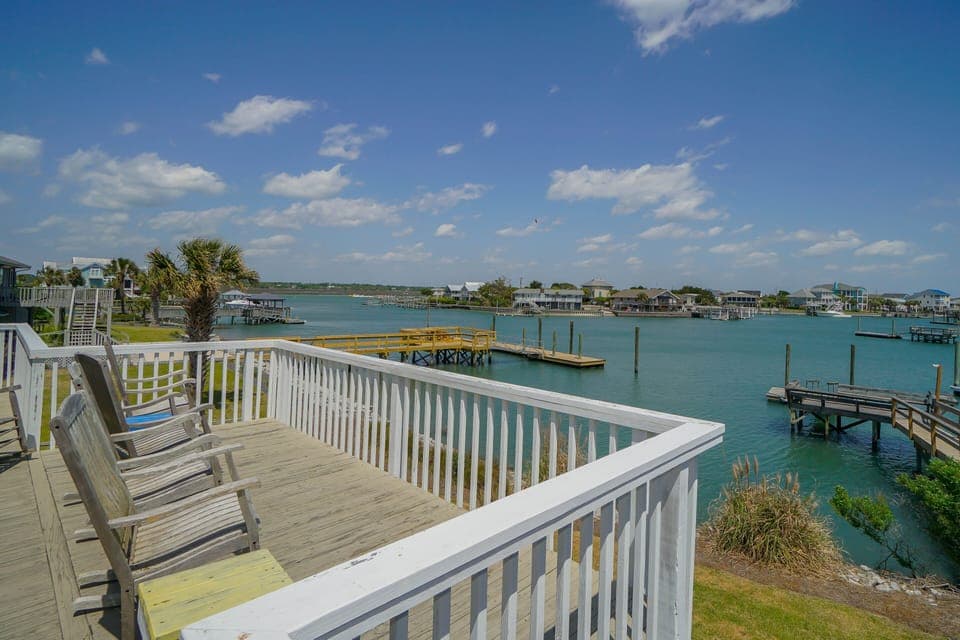Step onto your private waterfront deck where inlet waters and peaceful marina views create the perfect backdrop for morning coffee or sunset relaxation.