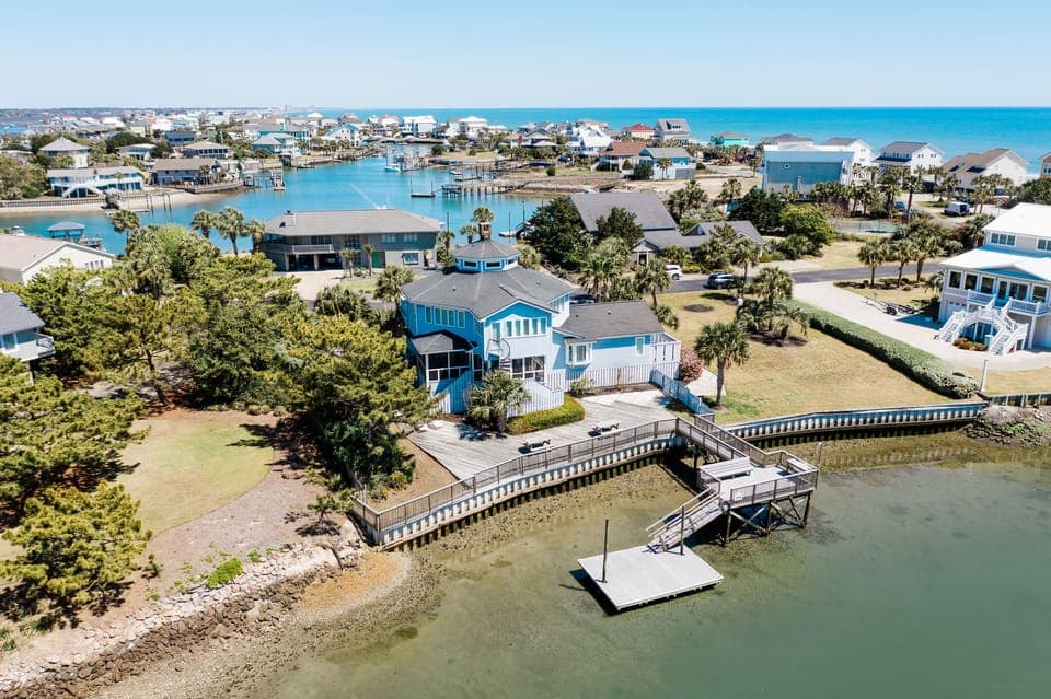 Coastal community with waterfront homes, private dock access, and scenic bay views in a peaceful seaside neighborhood.