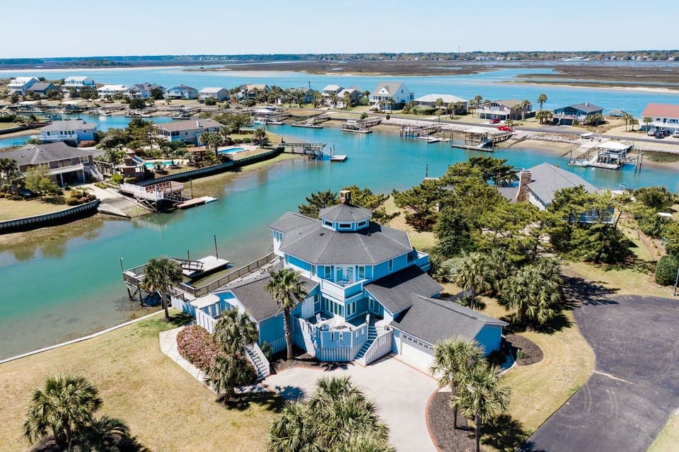 Stunning waterfront property with private dock access and panoramic views of the inlet bay and coastal community.