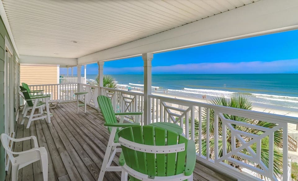Sip your morning coffee from this oceanfront balcony while watching waves roll onto pristine sand below.