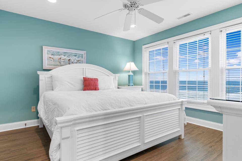 Wake up to breathtaking ocean views in this serene bedroom with coastal charm and cooling sea breezes.