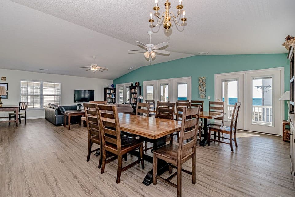 Gather your group around the spacious dining table while enjoying the coastal breeze from your private balcony doors.