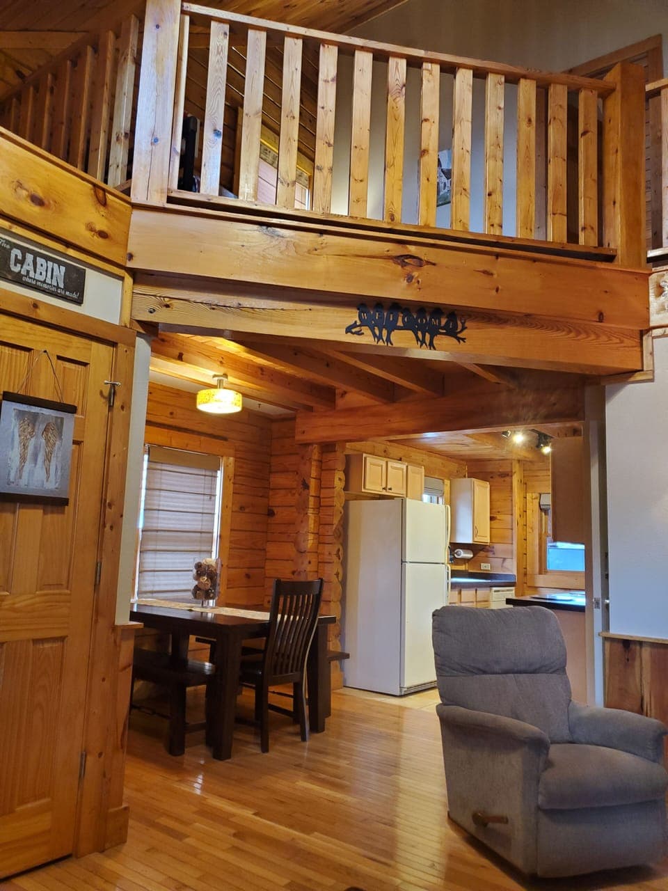 Dining area is off living room and leads to Kitchen and back deck.