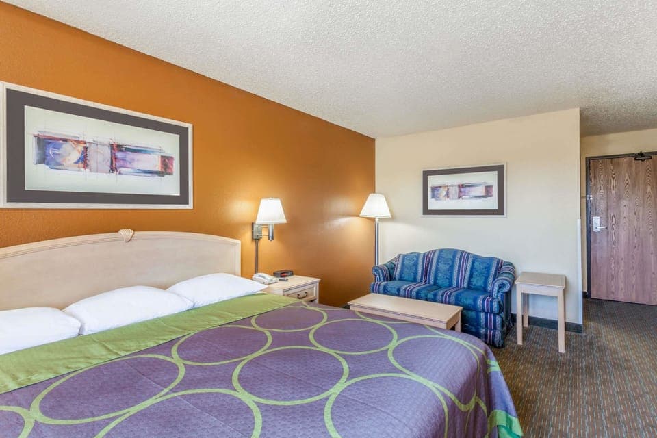 Suite, 1 King Bed, Microwave | Desk, laptop workspace, blackout drapes, iron/ironing board