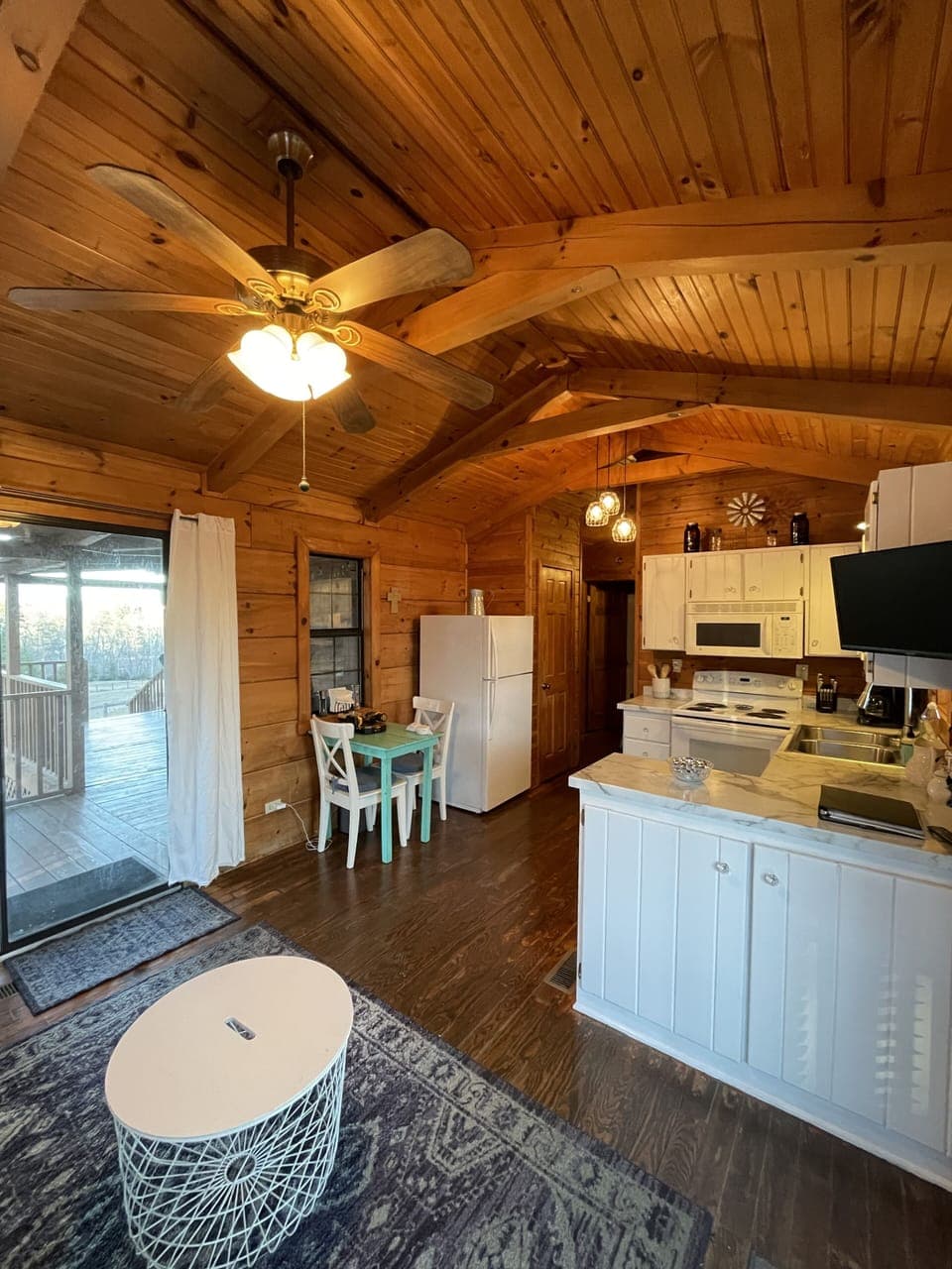 Kitchen and eat-in dining opens onto back porch for optional outdoor dining