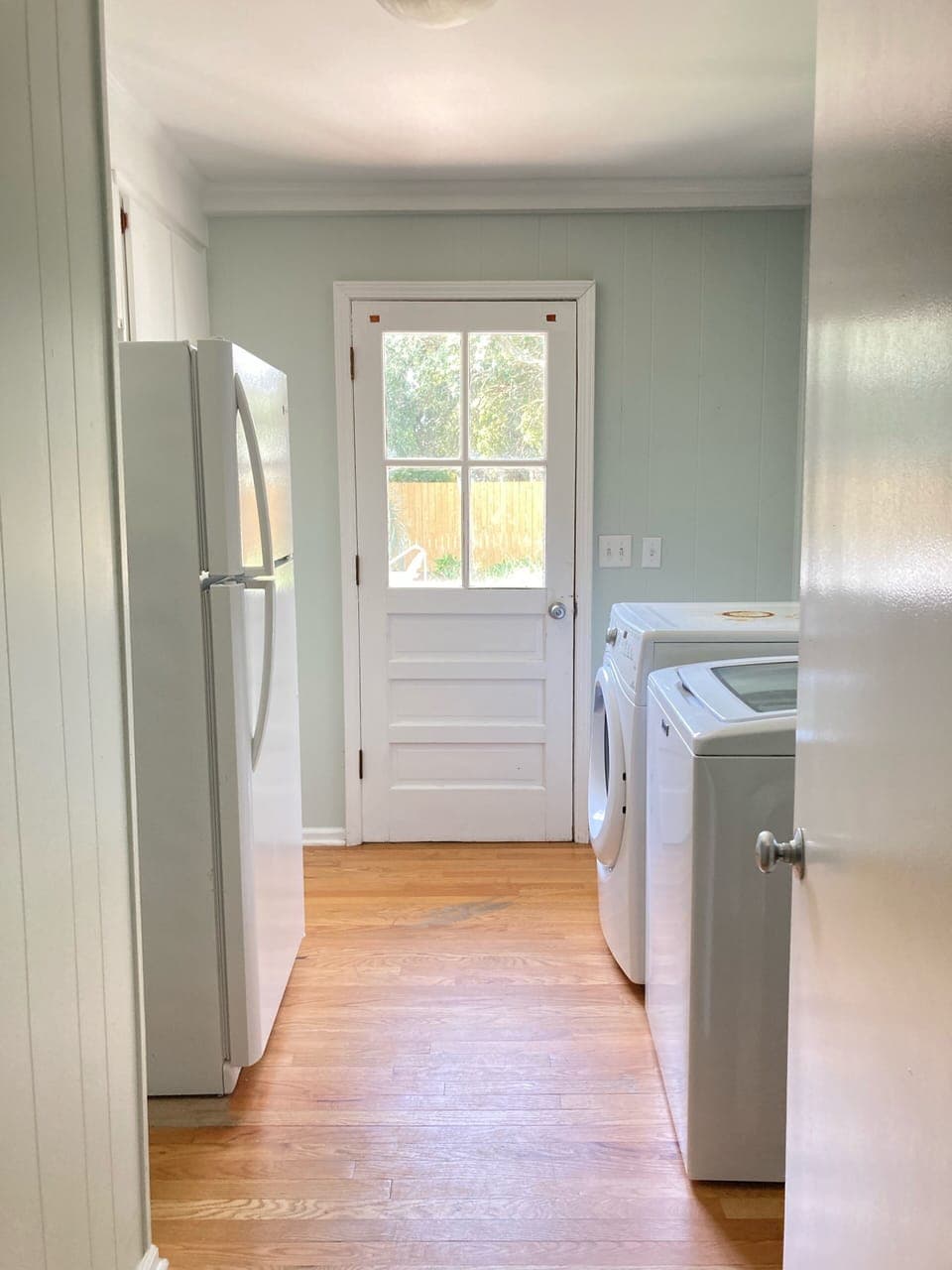 Laundry room with extra refrigerator 