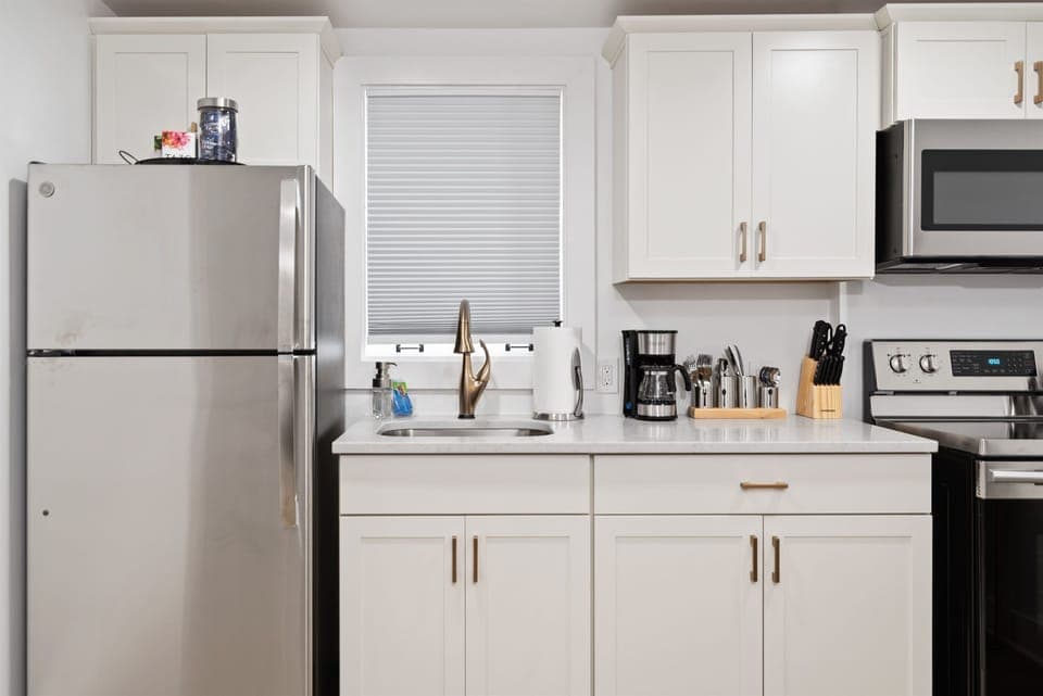 Small but mighty: the kitchen has everything you'll need. Coffee maker has been replaced with a Keurig.