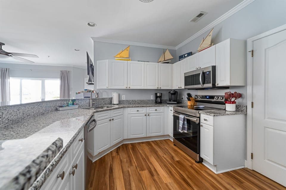 Full kitchen with granite countertops and stainless steel appliances