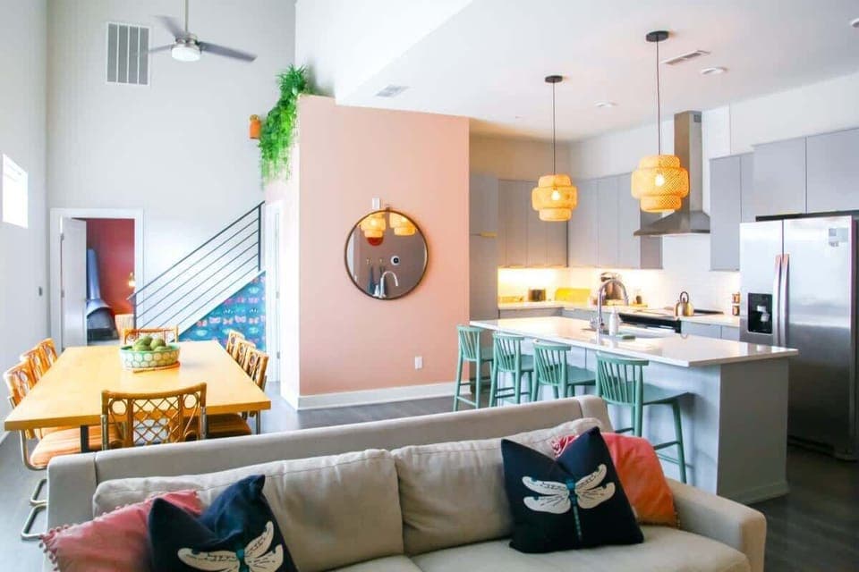 This bright and airy living room is the perfect spot to relax after exploring Nashville, with a cozy couch and streaming TV