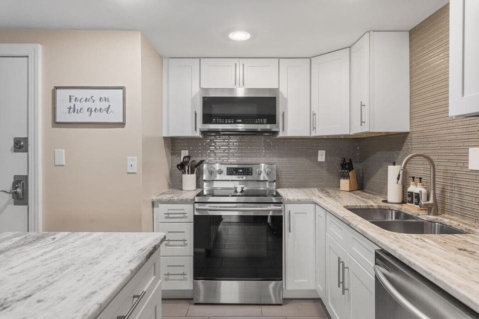 Fully equipped kitchen for all of your cooking needs! Regular drip coffee machine and coffee provided! Seating available at the island. The kitchen opens up to the living room, great for entertaining!